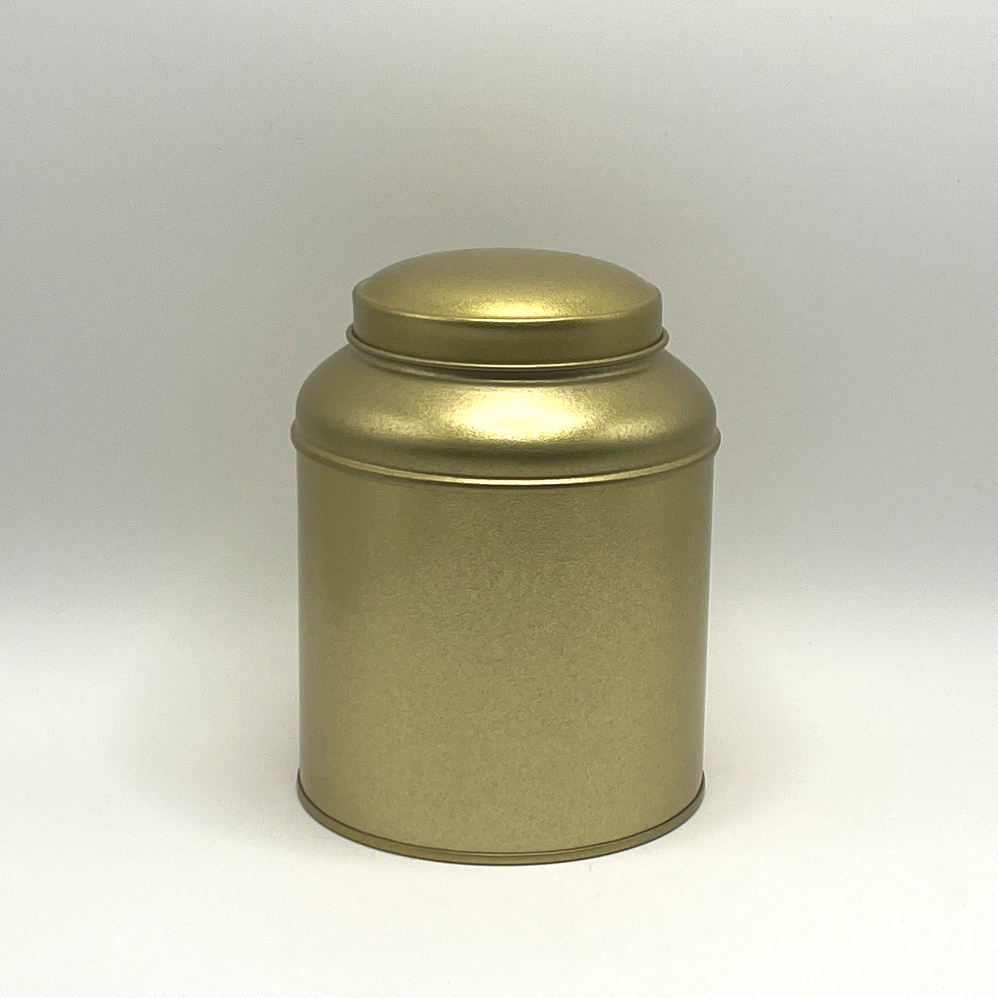 lata dorada para almacenar té 